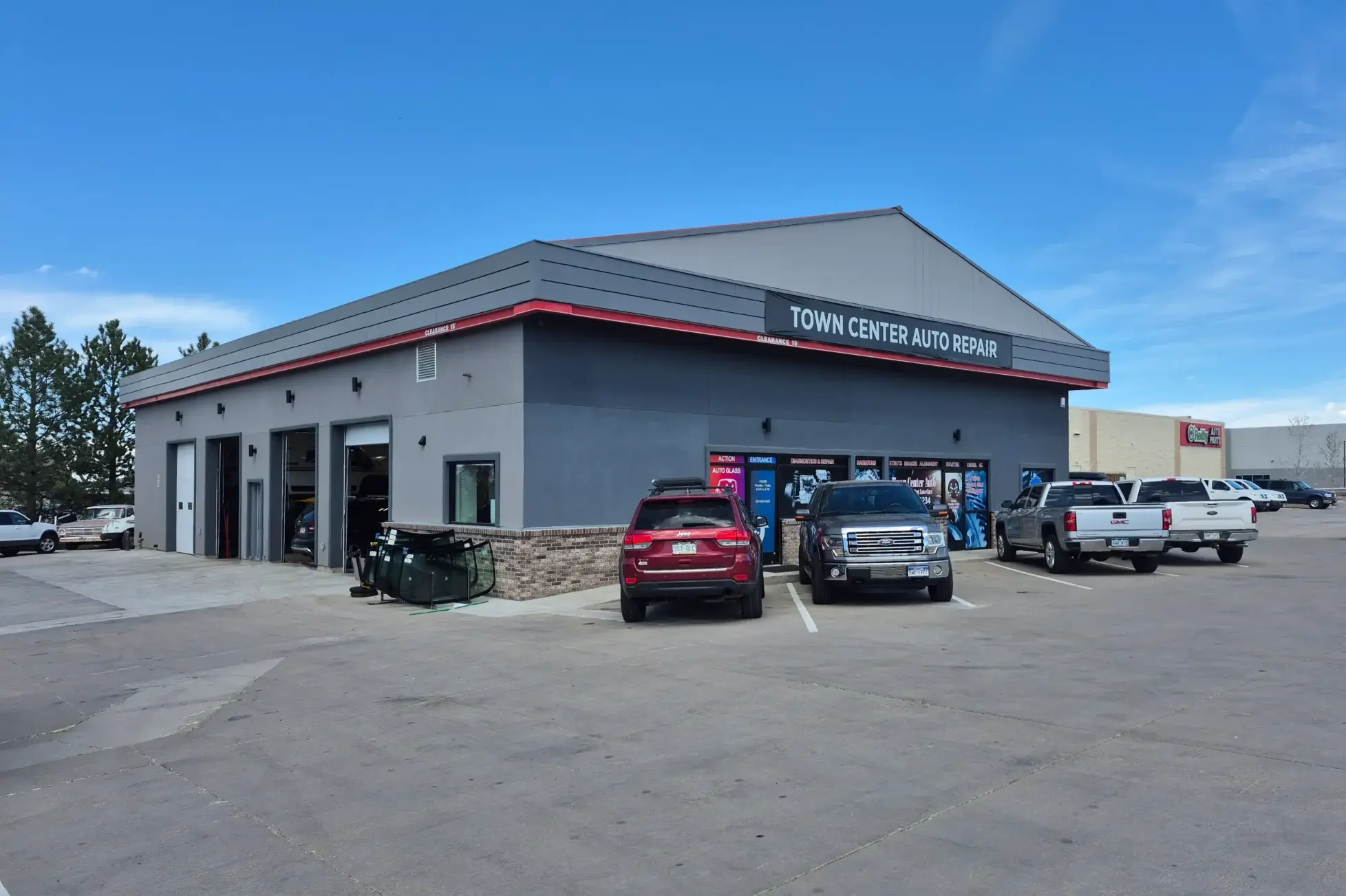Town Center Auto Repair's eight-bay shop on Carder Court, with customer trucks parked out front